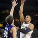 Michigan sophomore Jordan Morgan takes a shot over Northwestern senior John Shurna in the second half at Crisler Center on Wedensday. Melanie Maxwell I AnnArbor.com